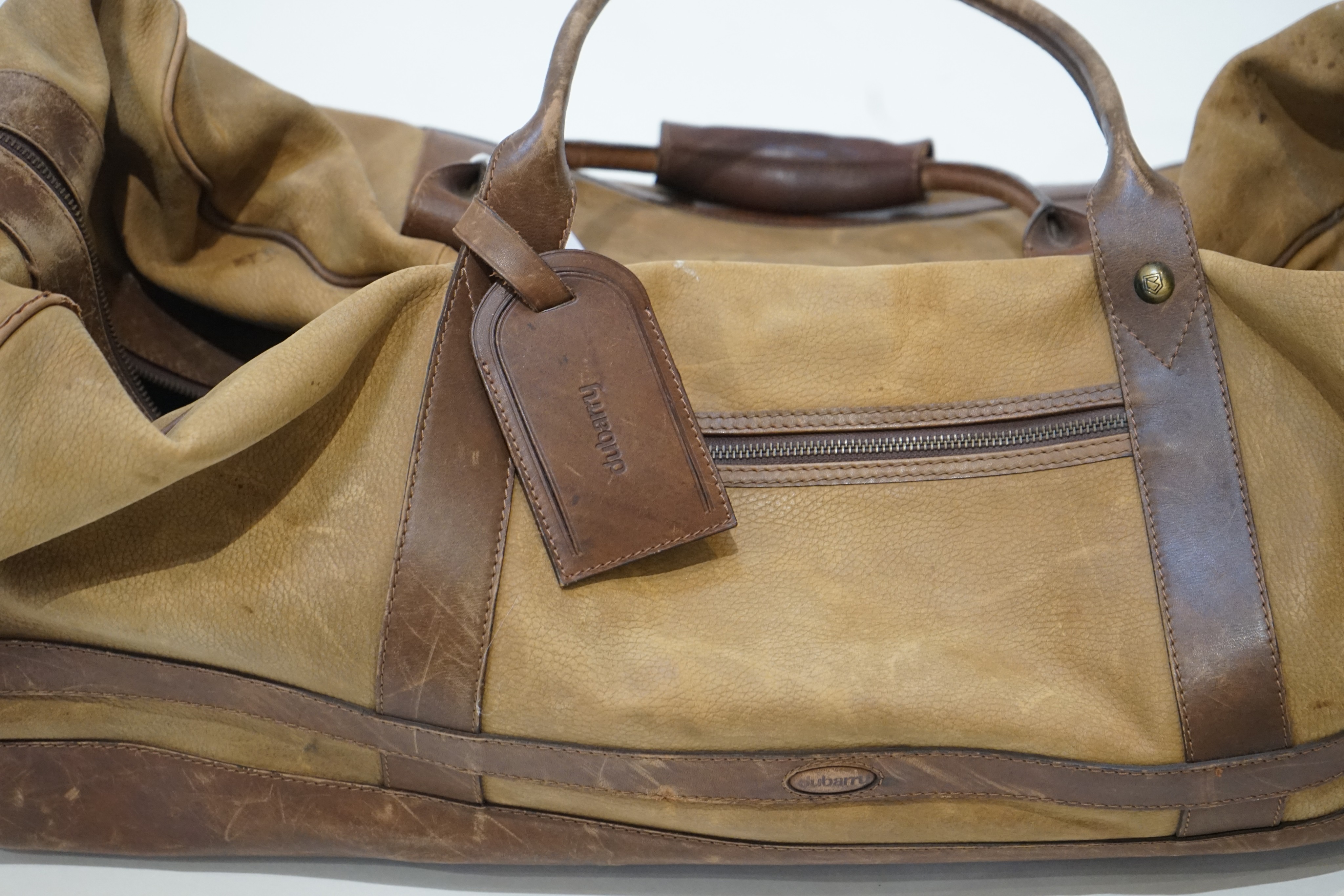 A large Dubarry leather travel bag and two pairs of gentleman's Dubarry brown leather boots, size 8.5/9